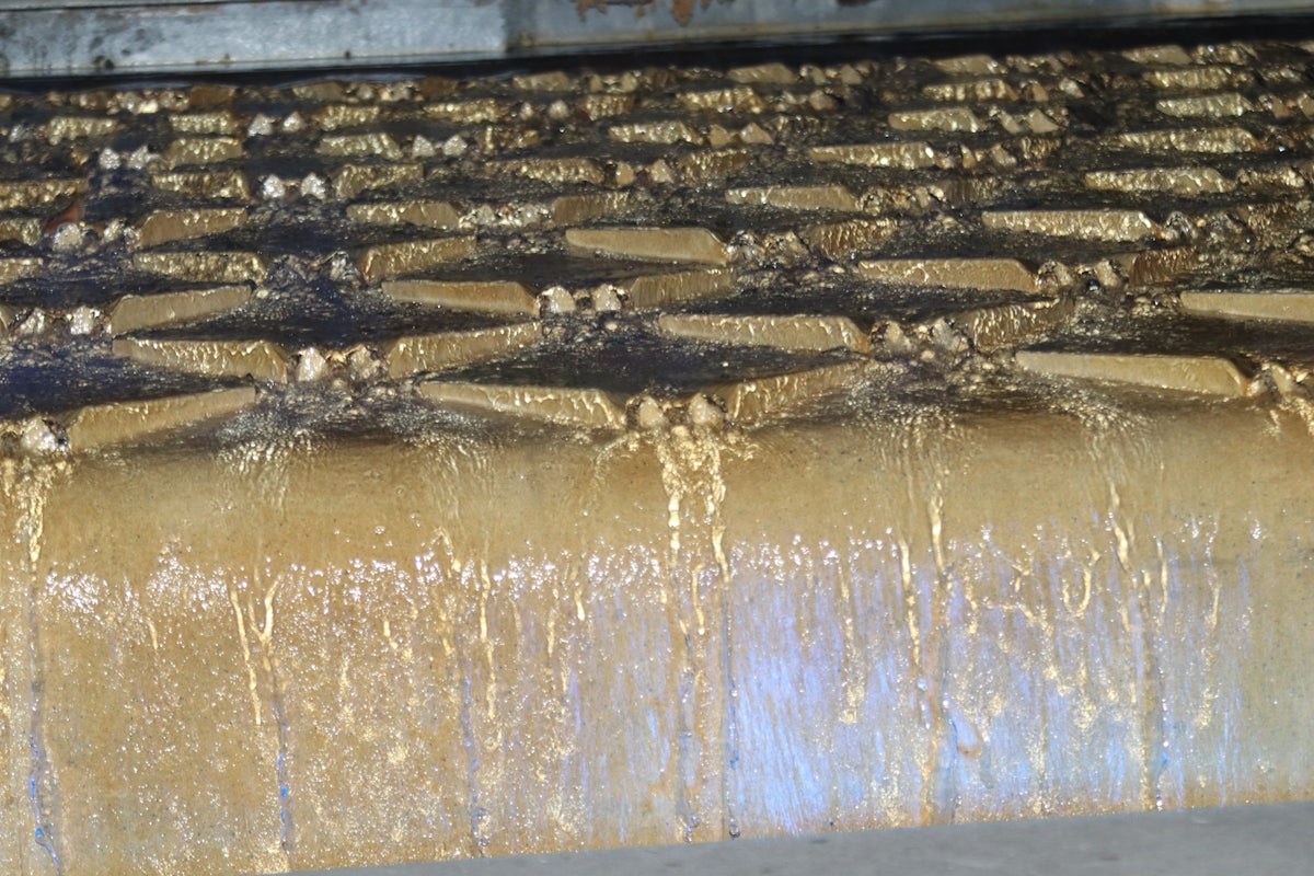 A large metal grate filled with lots of water